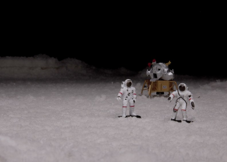 astronauts lunar module on salt flats at night