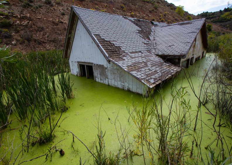 photo wide view abandoned flooded home