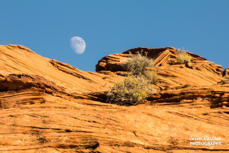 Photo of moon rising over the rocks